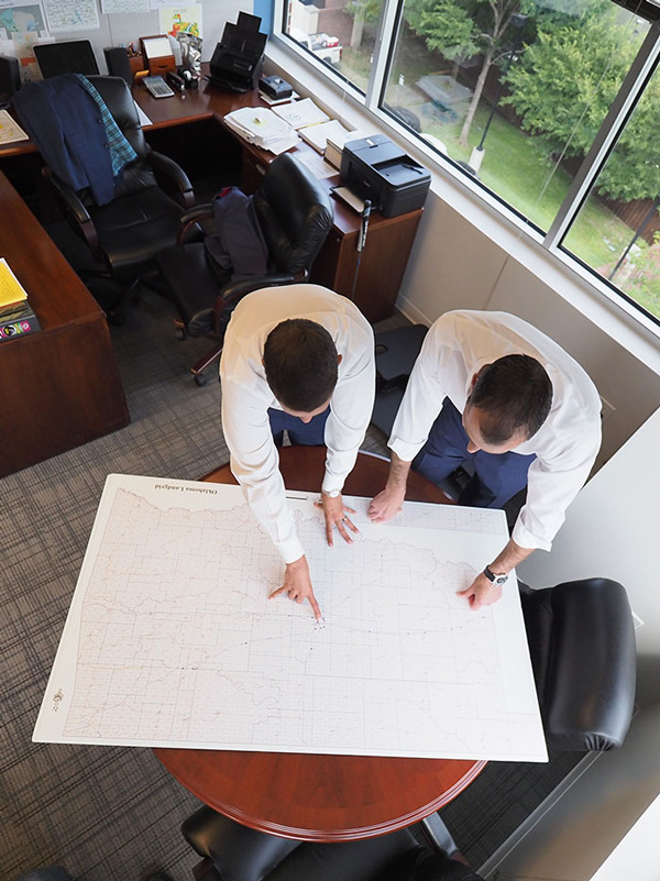 two business men professional energy guys working at table overhead view